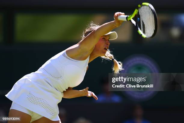 Caroline Wozniacki of Denmark serves against Varvara Lepchenko of the United States during their Ladies' Singles first round match on day one of the...