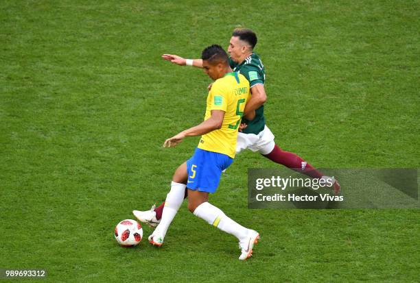 Casemiro of Brazil battles for possession with Hector Herrera of Mexico during the 2018 FIFA World Cup Russia Round of 16 match between Brazil and...