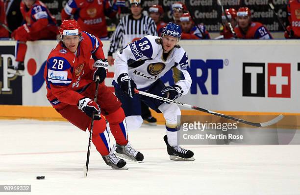 Alexander Semin of Russia and Andrei Gavrilin of Kazakhstan battle for the puck during the IIHF World Championship group A match between Russia and...