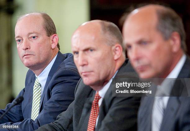 Lamar McKay, president and chairman of BP America Inc., left, Steven Newman, president and chief executive officer of Transocean Ltd., center, and...