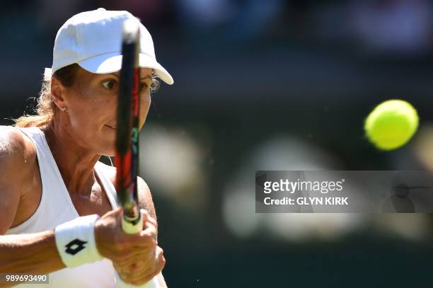 Player Varvara Lepchenko returns to Denmark's Caroline Wozniacki during their women's singles first round match on the first day of the 2018...