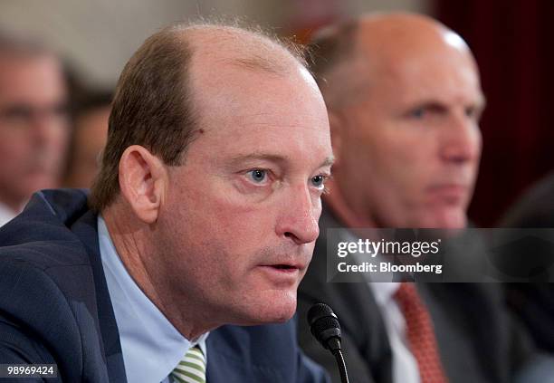 Lamar McKay, president and chairman of BP America Inc., left, speaks during a Senate Energy and Natural Resources Committee hearing on offshore oil...