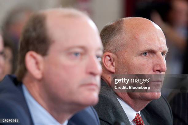 Steven Newman, president and chief executive officer of Transocean Ltd., right, and Lamar McKay, president and chairman of BP America Inc., listen...