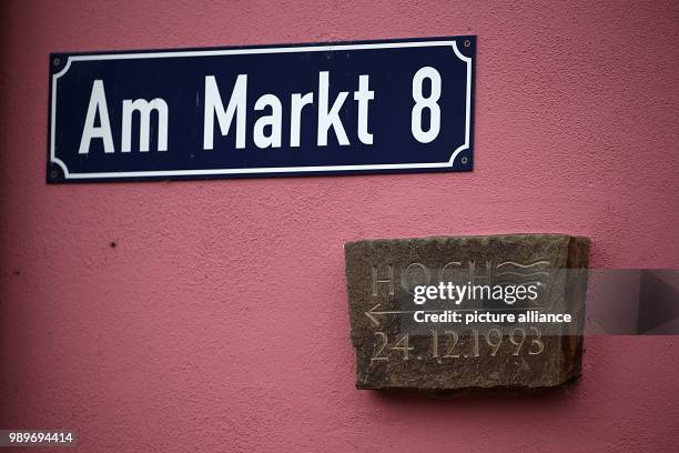 Plaque on a house wall commemorates the last great flood of 1993 in the Zuendorf district of Cologne, Germany, 5 January 2018. The river Rhine is...