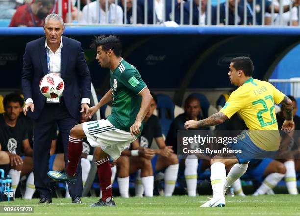 Tite, Head coach of Brazil watches Carlos Vela of Mexico challenged by Fagner of Brazil during the 2018 FIFA World Cup Russia Round of 16 match...