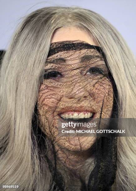 Singer Lady Gaga smiles on stage as she receives three "Echo" music awards ahead of her concert in Berlin on May 11, 2010. Lady Gaga received three...