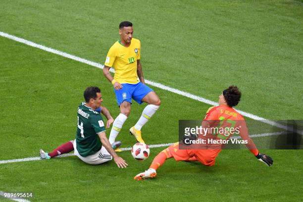 Guillermo Ochoa of Mexico looks to save a shot from Neymar Jr of Brazil during the 2018 FIFA World Cup Russia Round of 16 match between Brazil and...
