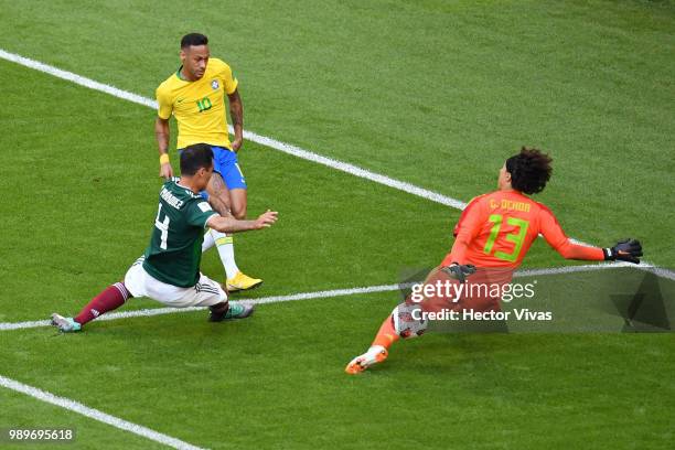 Guillermo Ochoa of Mexico looks to save a shot from Neymar Jr of Brazil during the 2018 FIFA World Cup Russia Round of 16 match between Brazil and...