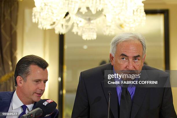 International Monetary Fund Managing-Director Dominique Strauss-Kahn seats next to Swiss National Bank chairman Philipp Hildebrand after a press...