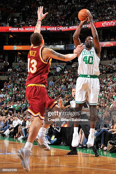 Michael Finley of the Boston Celtics puts a shot up over Delonte West of the Cleveland Cavaliers in Game Three of the Eastern Conference Semifinals...