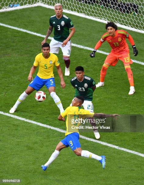 Gabriel Jesus of Brazil shoots past Jesus Gallardo of Mexico during the 2018 FIFA World Cup Russia Round of 16 match between Brazil and Mexico at...