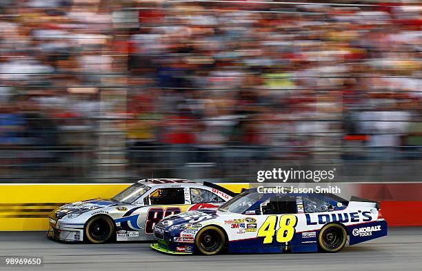 Scott Speed, driver of the Red Bull Toyota, leads Jimmie Johnson, driver of the Lowe's Chevrolet, during the NASCAR Sprint Cup series SHOWTIME...