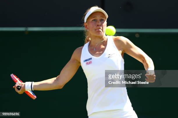 Johanna Larsson of Sweden returns to Venus Williams of the United States during their Ladies' Singles first round match on day one of the Wimbledon...