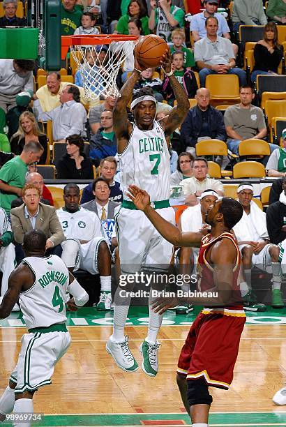 Marquis Daniels of the Boston Celtics comes down with a rebound over Leon Powe of the Cleveland Cavaliers in Game Three of the Eastern Conference...