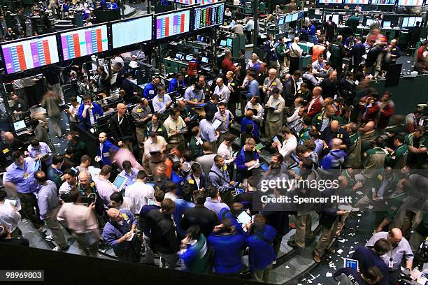 Traders in crude oil and natural gas options work on the floor of the New York Mercantile Exchange on May 11, 2010 in New York City. Shedding earlier...