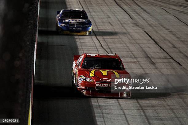 Jamie McMurray, driver of the McDonald's Chevrolet, leads Kurt Busch, driver of the Miller Lite Dodge, during the NASCAR Sprint Cup series SHOWTIME...