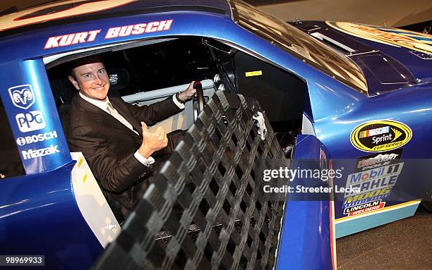 Kurt Busch sits in his car during the NASCAR Hall of Fame Grand Opening at the NASCAR Hall of Fame on May 11, 2010 in Charlotte, North Carolina.