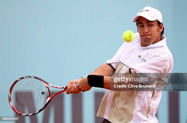 Daniel Munoz-De La Nava of Spain serves against Sam Querrey of the USA in their first round match during the Mutua Madrilena Madrid Open tennis...