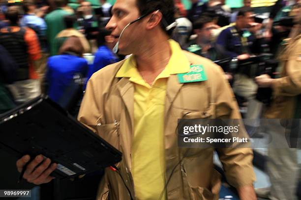 Traders in crude oil and natural gas options work on the floor of the New York Mercantile Exchange on May 11, 2010 in New York City. Shedding earlier...