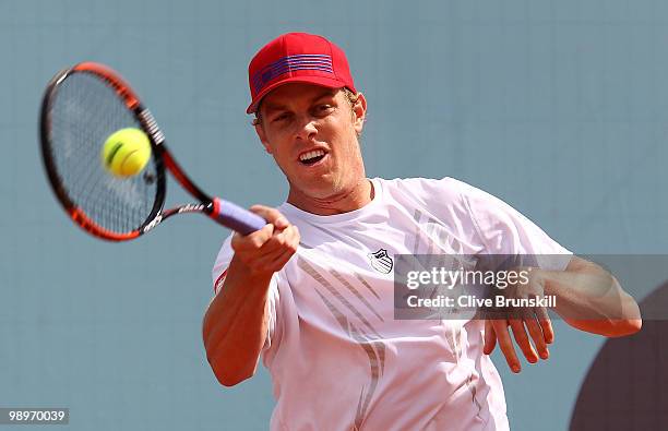 Sam Querrey of the USA plays a forehand against Daniel Munoz-De La Nava of Spain in their first round match during the Mutua Madrilena Madrid Open...