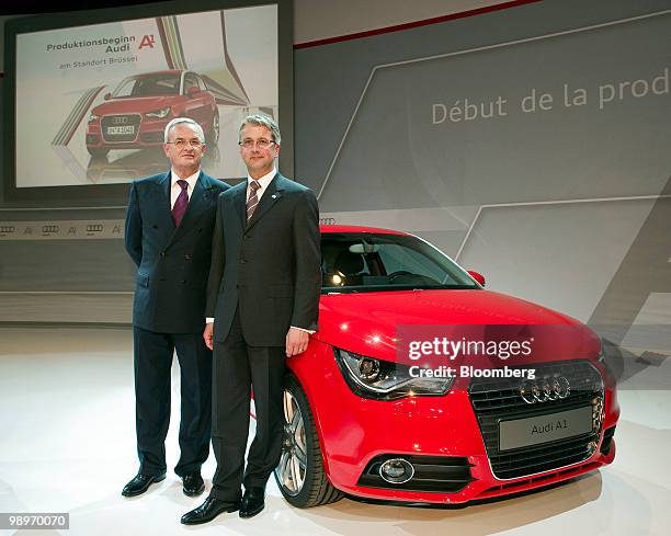 Martin Winterkorn, chief executive officer of Volkswagen AG, left, and Rupert Stadler, chief executive officer of Audi AG, pose next to an Audi A1 at...