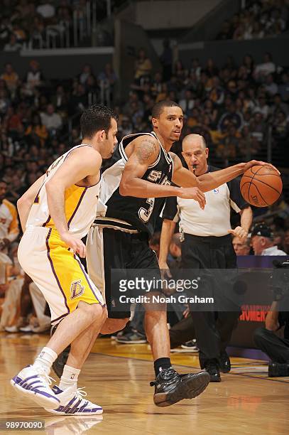 George Hill of the San Antonio Spurs dribble the ball against Jordan Farmar of the Los Angeles Lakers at Staples Center on April 4, 2010 in Los...