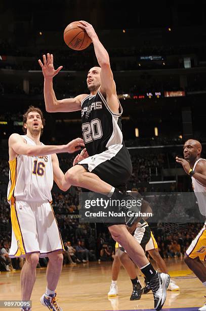 Manu Ginobili of the San Antonio Spurs makes a layup against Pau Gasol of the Los Angeles Lakers at Staples Center on April 4, 2010 in Los Angeles,...