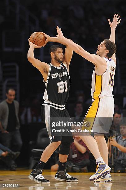 Tim Duncan of the San Antonio Spurs moves the ball against Pau Gasol of the Los Angeles Lakers at Staples Center on April 4, 2010 in Los Angeles,...
