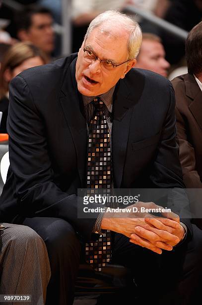 Head coach Phil Jackson of the Los Angeles Lakers talks to his assistant coaches during the game against the Toronto Raptors on March 9, 2010 at...