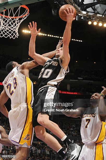 Manu Ginobili of the San Antonio Spurs makes a layup against Didier Ilunga-Mbenga of the Los Angeles Lakers at Staples Center on April 4, 2010 in Los...