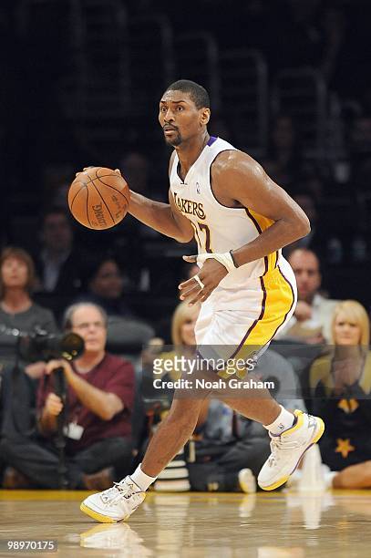 Ron Artest of the Los Angeles Lakers dribbles the ball against the San Antonio Spurs at Staples Center on April 4, 2010 in Los Angeles, California....