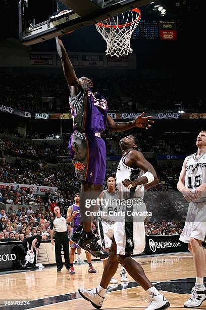 Jason Richardson of the Phoenix Suns goes to the basket over Antonio McDyess of the San Antonio Spurs in Game Four of the Western Conference...