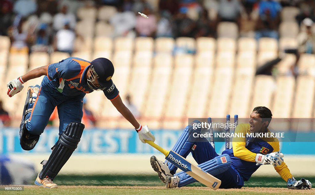 Indian cricketer Yusuf Pathan(L) lunges