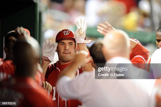 Ryan Zimmerman of the Washington Nationals celebrates with teammates after hitting a home run against the Florida Marlins at Nationals Park on May 7,...