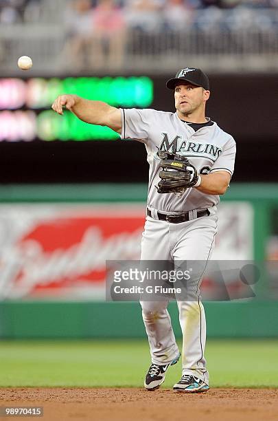 Dan Uggla of the Florida Marlins throws the ball to first base during the game against the Washington Nationals at Nationals Park on May 7, 2010 in...