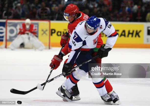 Andrei Stas of Belarus and Michal Macho of Slovakia battle for the puck during the IIHF World Championship group A match between Belarus and Slovakia...