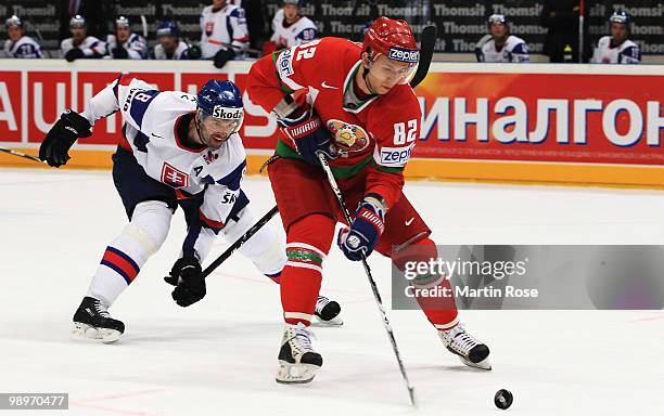 Artyom Senkevich of Belarus and Ivan Majesky of Slovakia battle for the puck during the IIHF World Championship group A match between Belarus and...