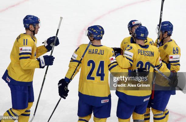 Carl Gunnarsson of Sweden celebrates his team's first goal with team mates during the IIHF World Championship group C match between Sweden and France...