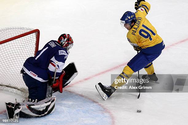 Magnus Paajarvi Svensson of Sweden tries to score against goalkeeper Eddy Ferhi of France during the IIHF World Championship group C match between...