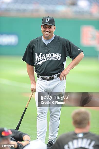 Manager Fredi Gonzalez of the Florida Marlins talks with players before the game against the Washington Nationals at Nationals Park on May 7, 2010 in...