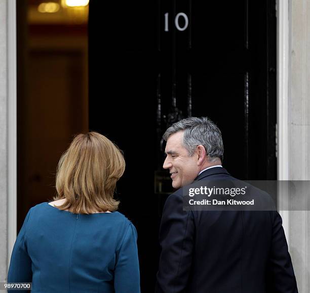 Prime Minister Gordon Brown and wife Sarah Brown prepare to leave Downing Street on May 11, 2010 in London, England. After five days of negotiation a...