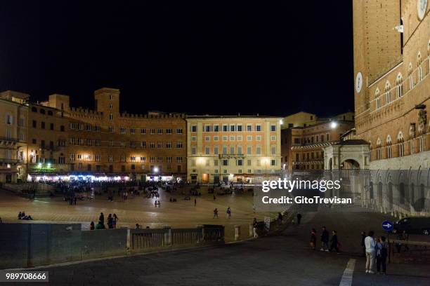 piazza cel campo at night, siena 2 - torre del mangia stock pictures, royalty-free photos & images