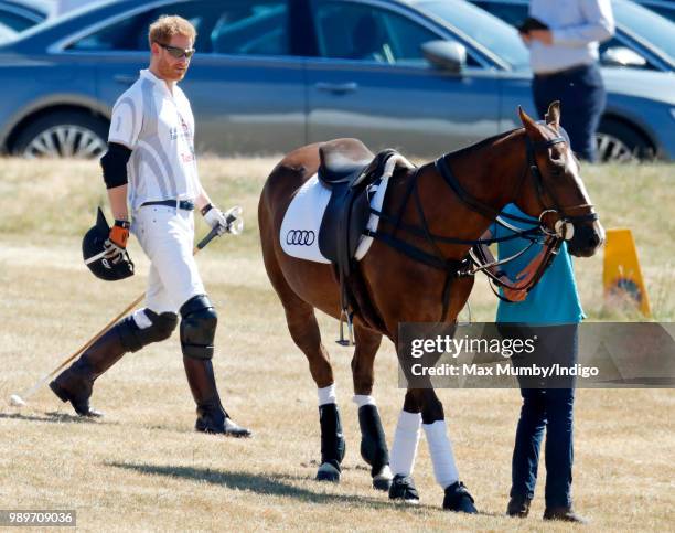 Prince Harry, Duke of Sussex takes part in the Audi Polo Challenge at Coworth Park Polo Club on June 30, 2018 in Ascot, England.