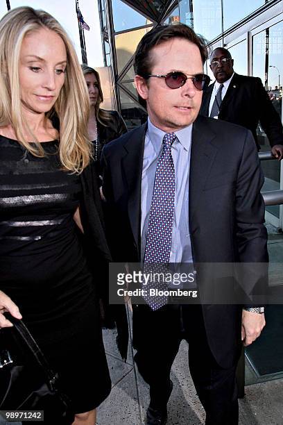 Actor Michael J. Fox, right, and his wife Tracy Pollan arrive for the Robin Hood Foundation gala in New York, U.S., on Monday, May 10, 2010. The...