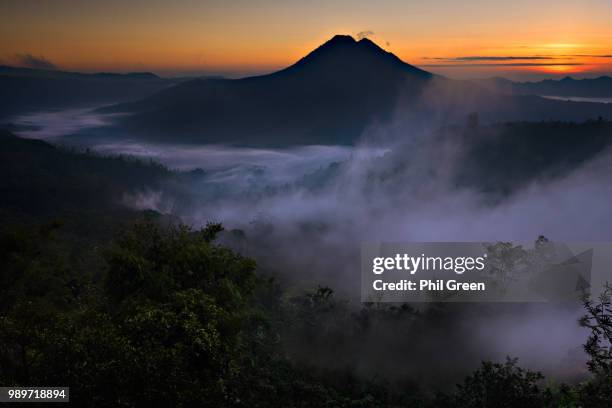 kintamani fog and light - kintamani stock pictures, royalty-free photos & images