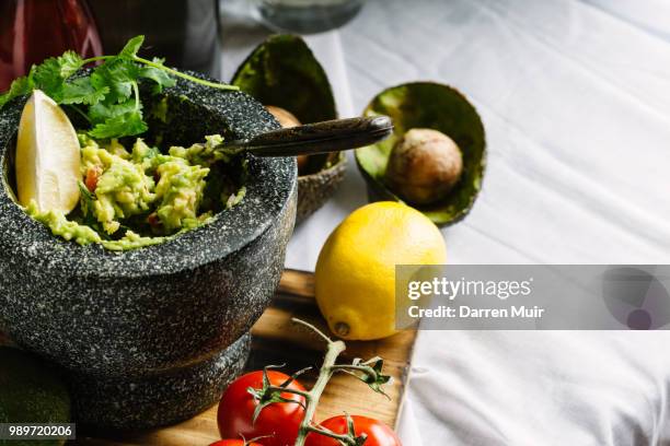 guacamole preparation - guacamole stock-fotos und bilder