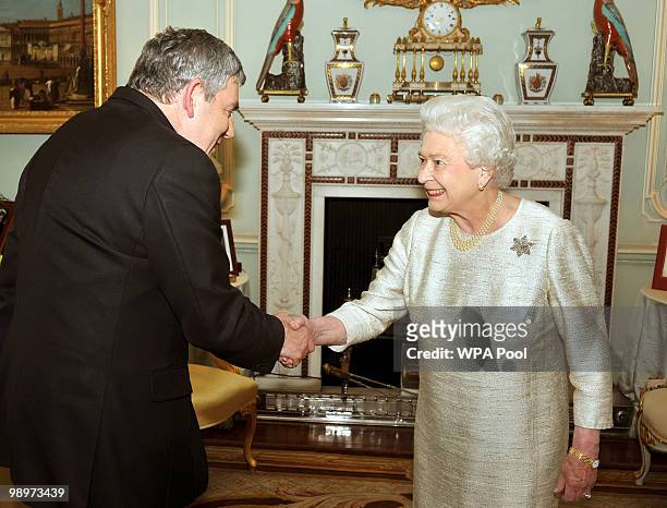 Queen Elizabeth II greets Gordon Brown at Buckingham Palace for an audience at which he tendered his resignation as Prime Minister, on May 11, 2010...