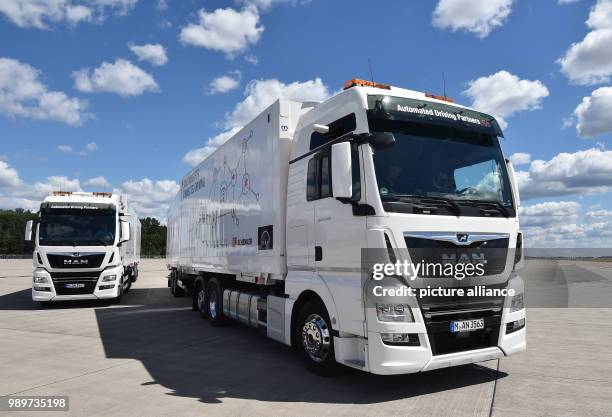 July 2018, Germany, Selchow: Trucks during a demonstration of platooning in autonomous driving in the unused south strip of Schoenefeld Airport....