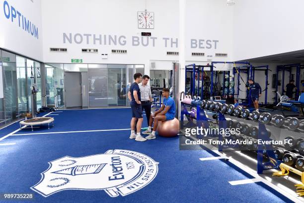 New Everton manager Marco Silva speaks with Dominic Calvert-Lewin as the Everton players return for training at USM Finch Farm on July 2, 2018 in...