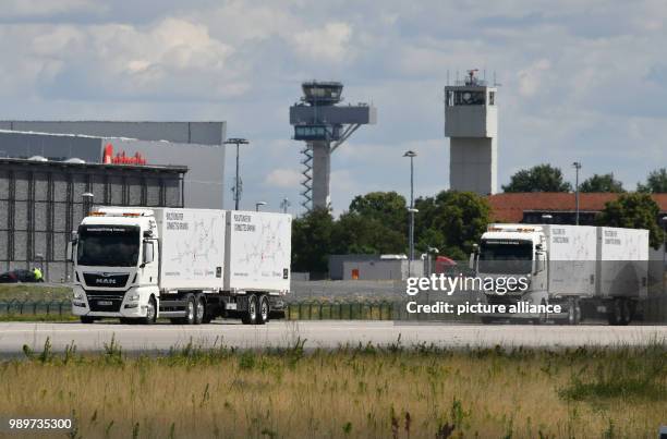 July 2018, Germany, Selchow: Trucks during a demonstration of platooning in autonomous driving in the unused south strip of Schoenefeld Airport....